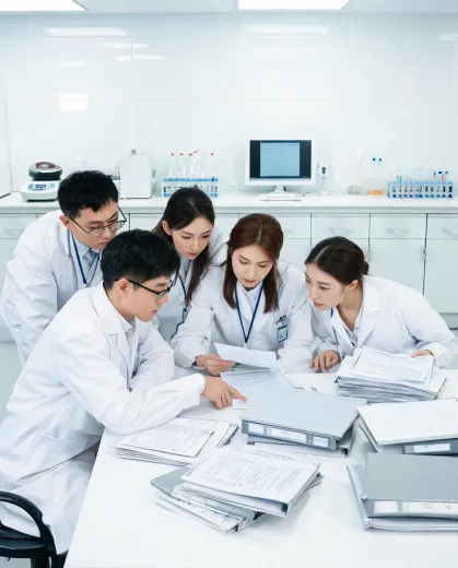 Regulatory team in lab coats